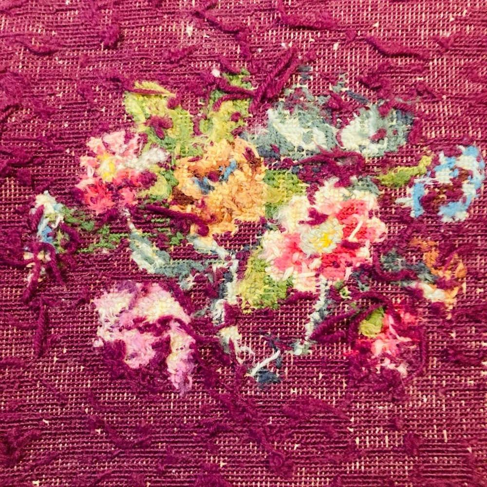 Beautiful vintage finished embroidery on burgundy wool, in fanciful floral’s